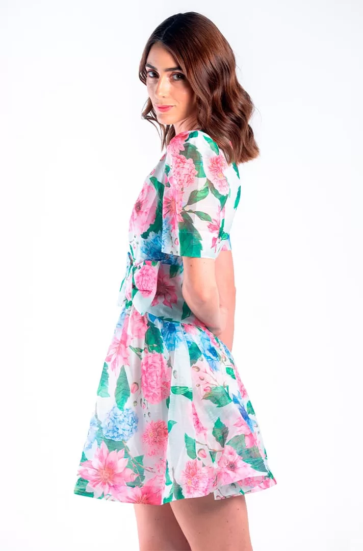 Vestido blanco con estampado floral y moño al frente
